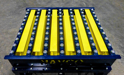 Custom grid top vibrating table with integrated ball transfer.